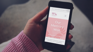 Katharine House Memory Wall web page shown on an iphone