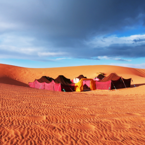 Sahara camp site Tents in between sand dunes in the Sahara
