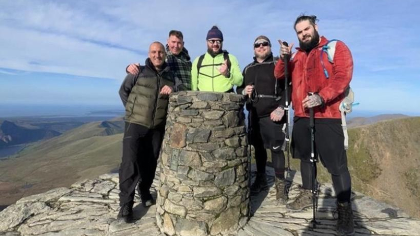 Ryan McQueen with friends Andy H, Kevin Weaver, Andy Laing, Daniel House and Boz De Niro at the summit of Kilimanjaro