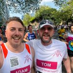 Charity runners Adam and Tom take a selfie during the 2025 London Marathon.