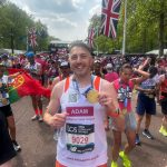 Charity runner Adam with his 2025 London Marathon medal after the race.