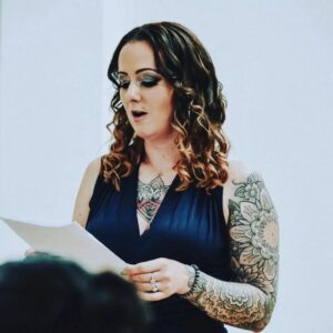 A woman reading a speech.