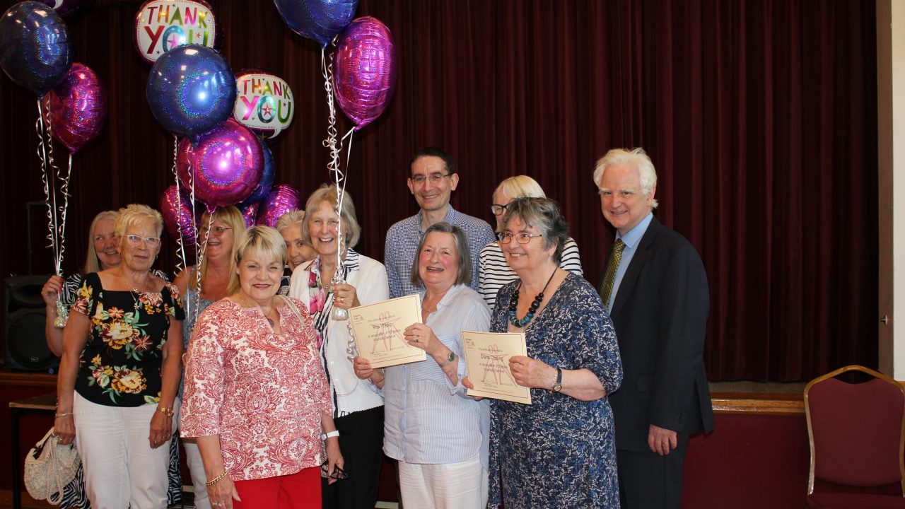 Volunteers smiling with their awards, with our Chief Executive Richard.