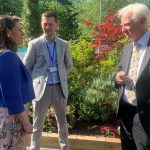 Stafford MP Theo Clarke, Director of Care, David Fletcher, and Chief Executive, Richard Soulsby talking in the gardens at Katharine House Hospice Therapy & Wellbeing Centre
