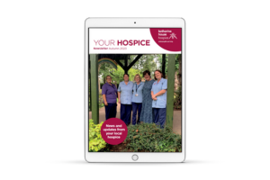 Your Hospice autumn 2023 newsletter front cover shown on an iPad. The cover features five female staff standing in the garden of Katharine House Hospice while smiling. 