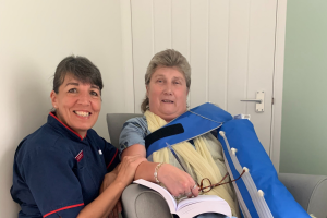 Lymphoedema nurse and her patient smiling.