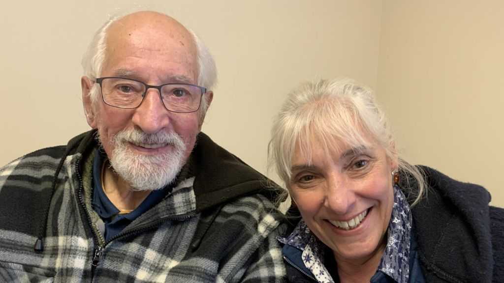 Ivan and his daughter Jane sit together smiling