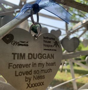 An example of the smaller hearts, which are engraved with a personal message and hung on the sculpture.