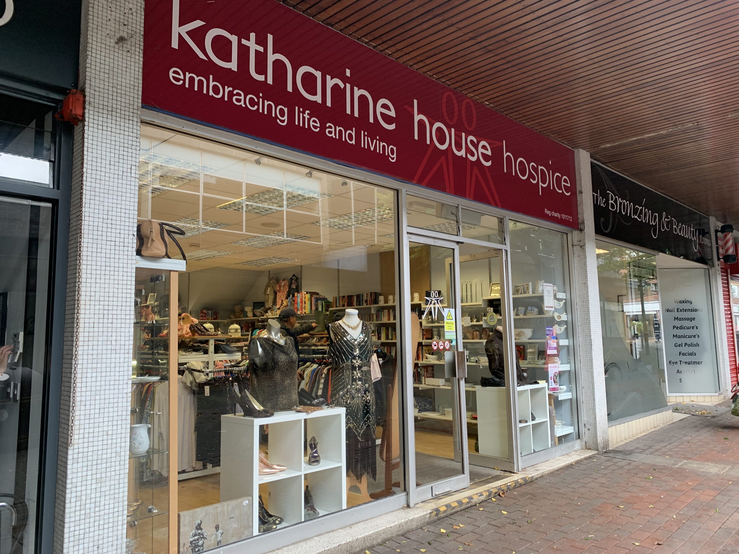 Photo of a shop front, the sign reads 'Katharine House Hospice'