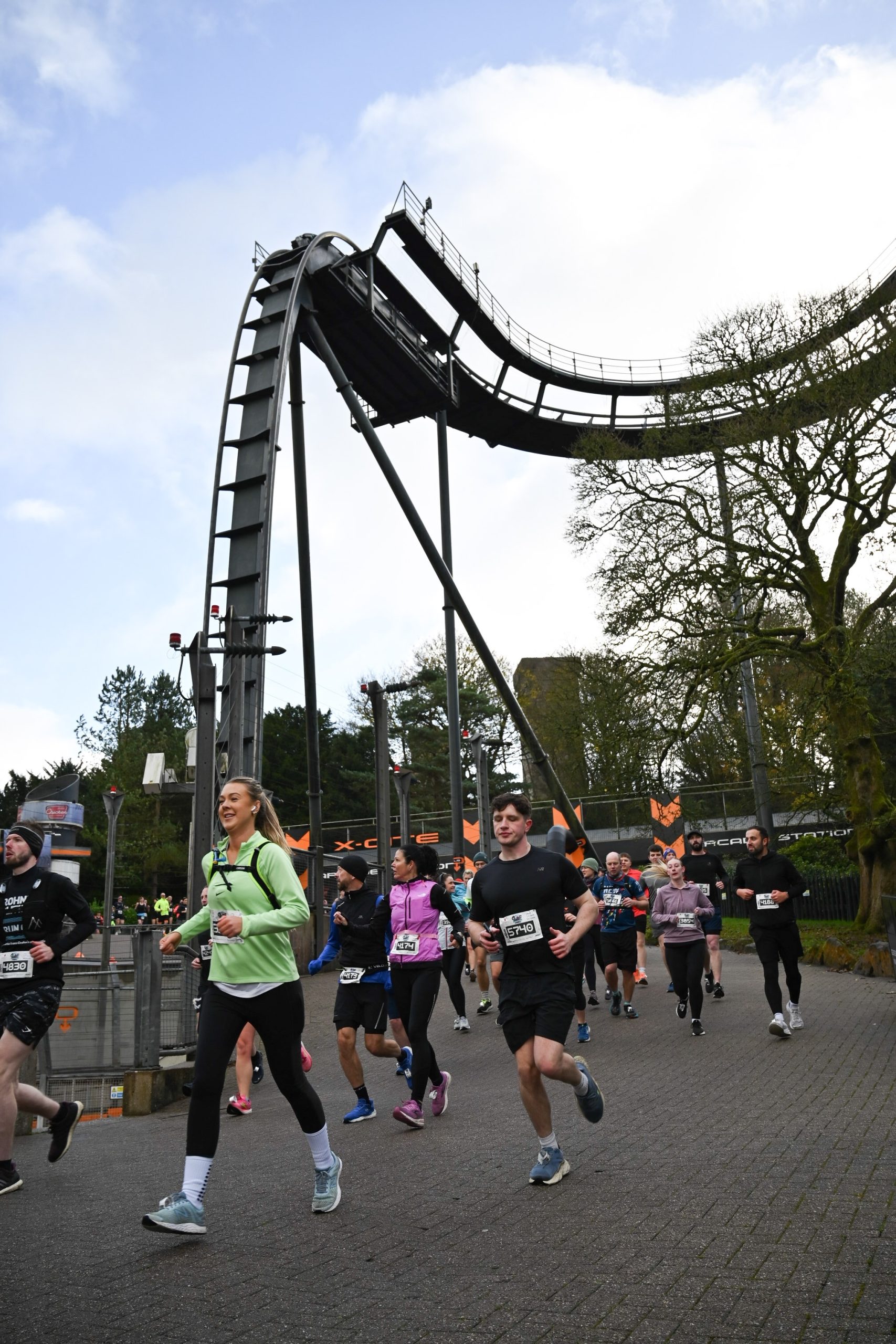 Run Alton Towers promo pics (2) People running past Oblivion rollercoaster.
