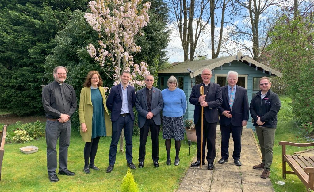 A group photo in our hospice gardens, our Chaplain David stands in the center.