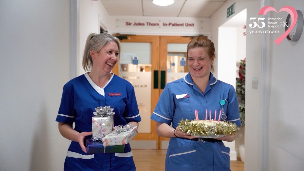 A still from the film: • Katharine House Hospice nurses help a patient celebrate a special occasion