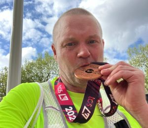 Ant Morgan with his London Marathon medal after the race,