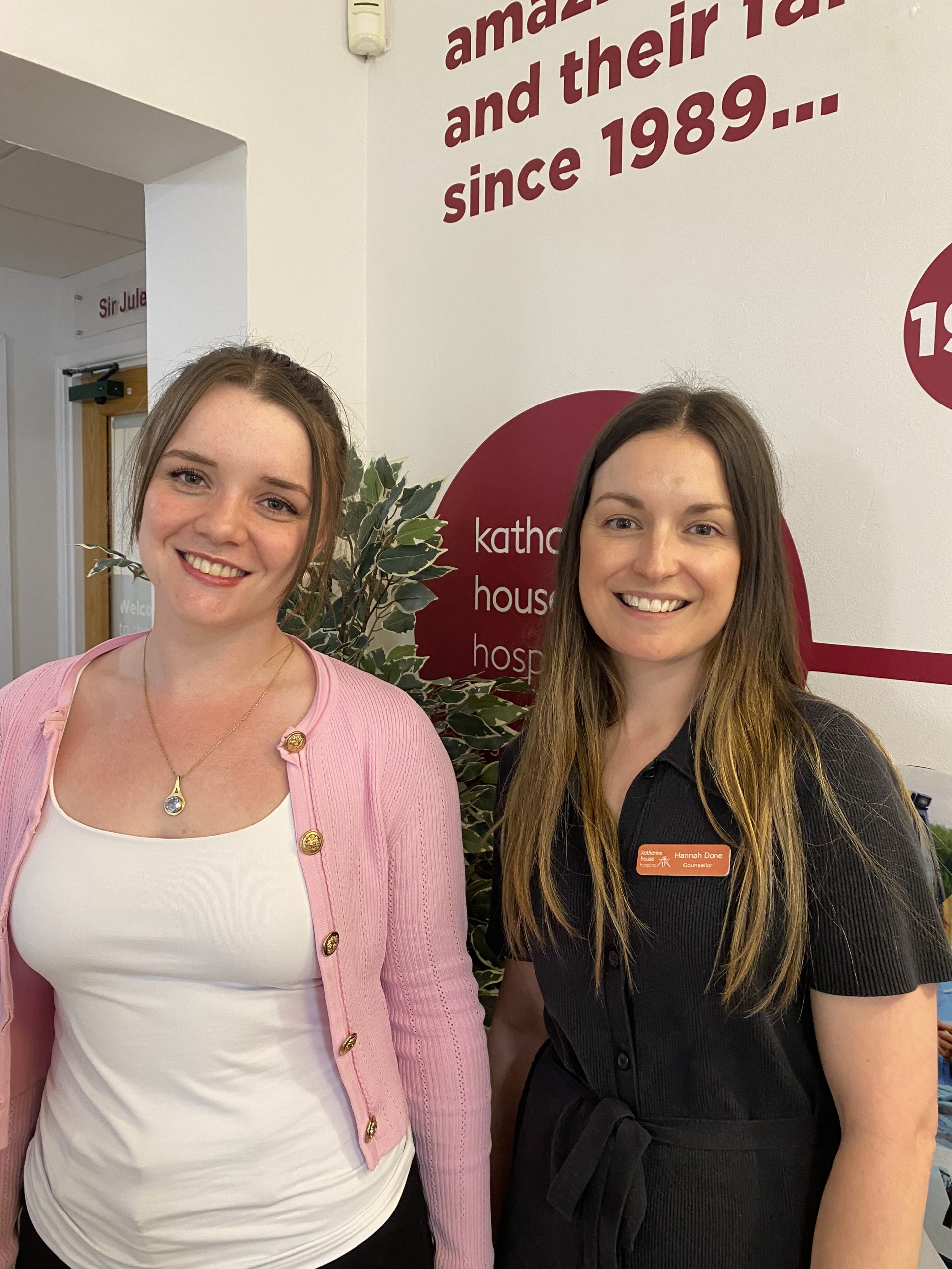 Volunteer Lucy with counsellor Hannah Done Lucy with counsellor Hannah, smiling to camera.