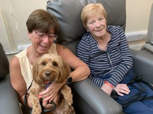 Isobel with daughter Alison and Cali the cockapoo
