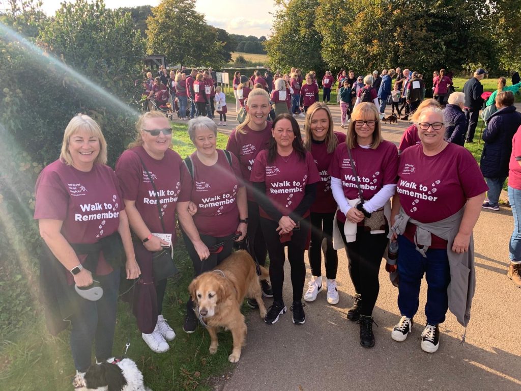Hospice at Home Team, Walk to Remember 2024 Group of walkers and dog in sunny country setting at Walk to Remember 2024
