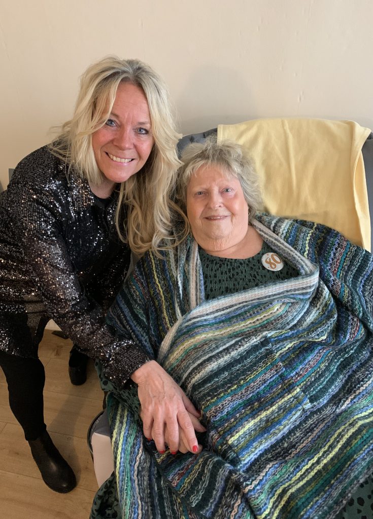 Joyful moment between mother and daughter at her 80th birthday celebration