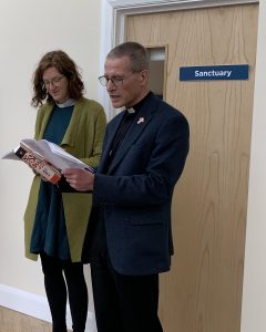 20240416_Care_David Clark liscensed as chaplain (8) Reverend David Clark sharing a reading. The scene is calm and relaxed.