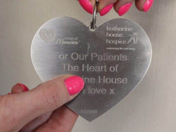 A meta heart with engraved text: 'For our patients'