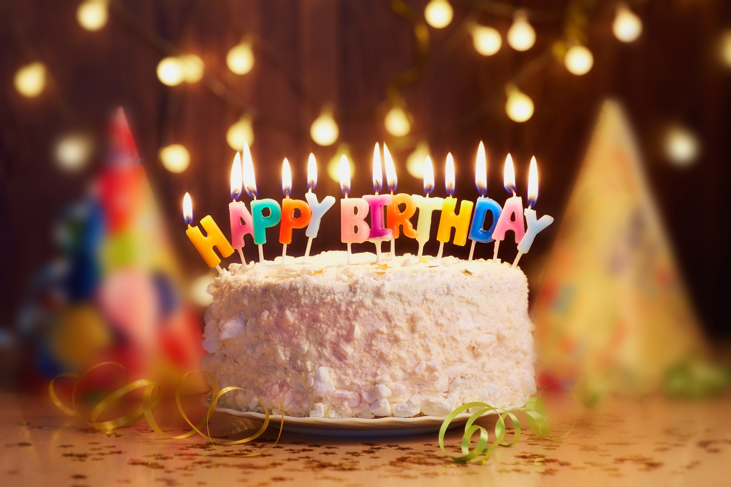 A birthday cake with lit candles