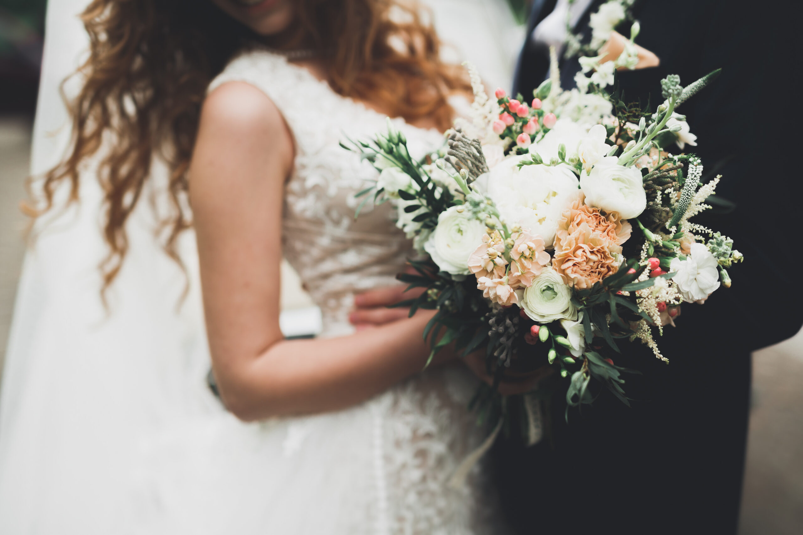 A bouquet of flowers held by a bride