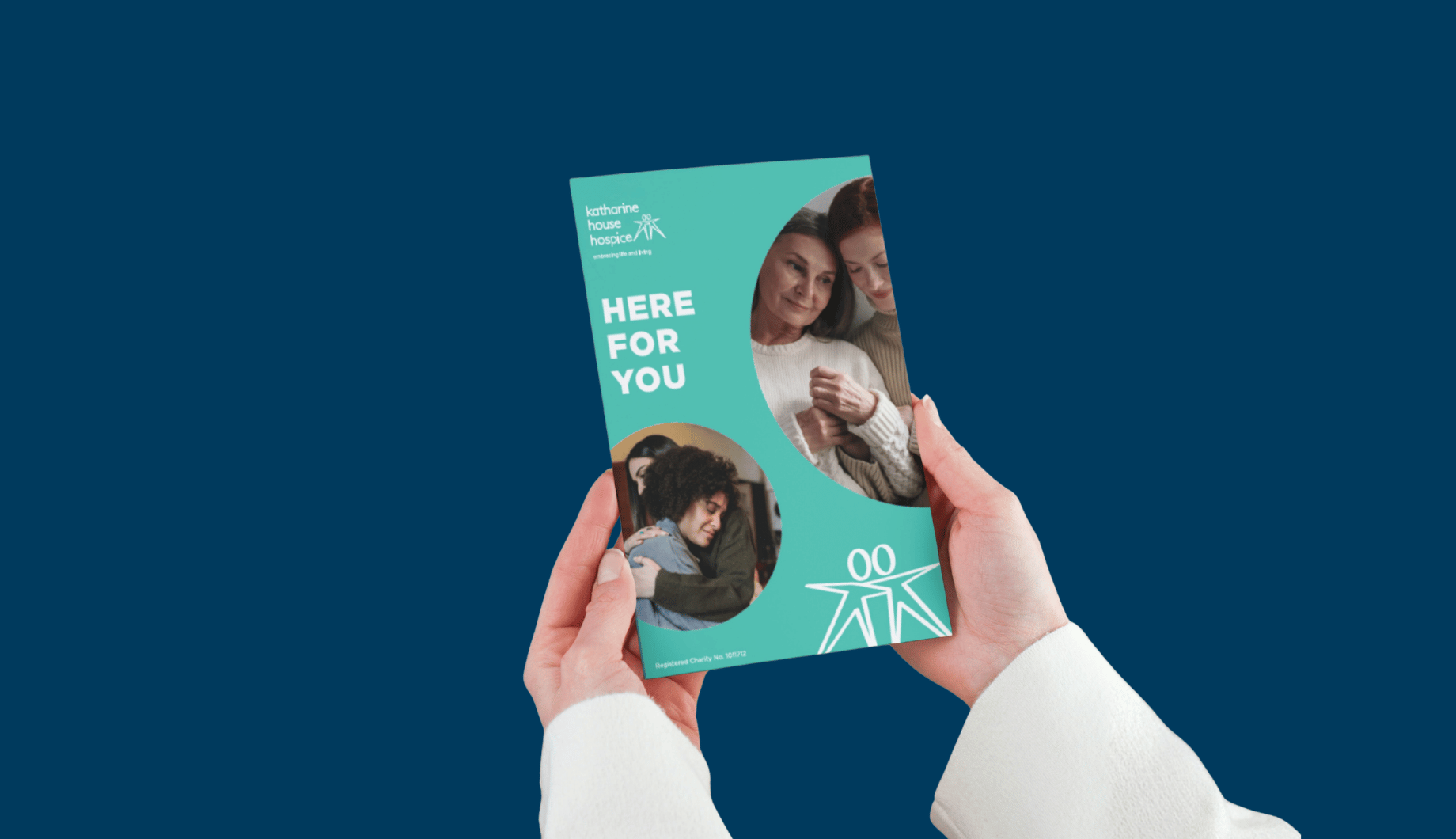 Close up of hands holding a leaflet titled 'Here for you'.