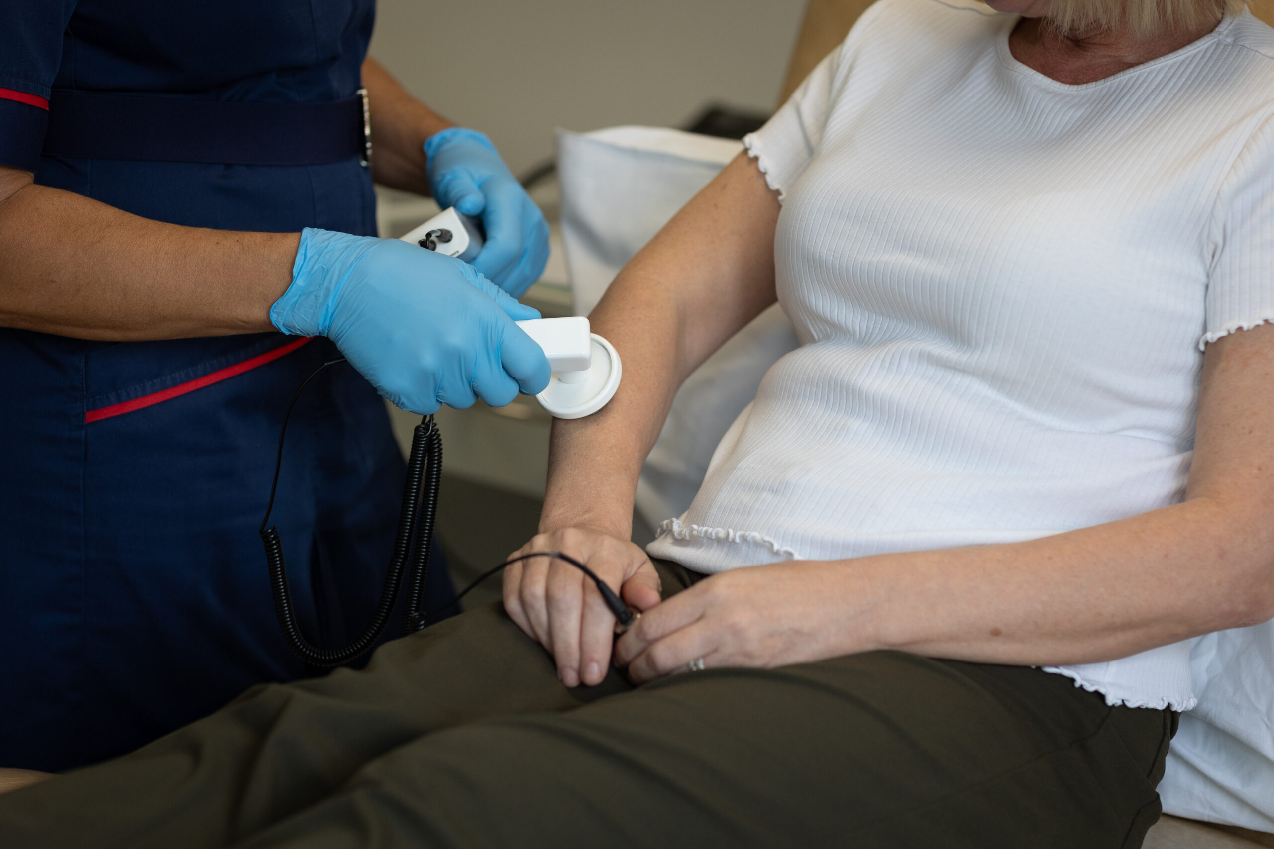Close-up of an arm having lymphoedema treatment.