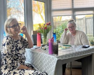 Two women playing scrabble.