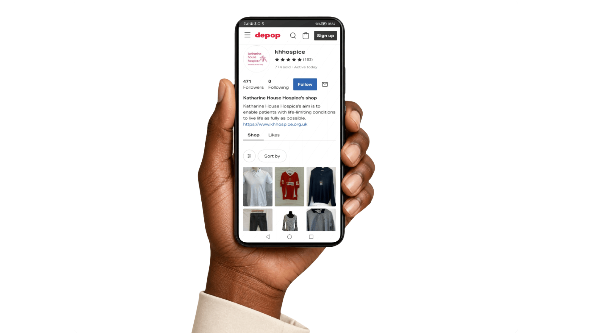 Hand holding a smartphone displaying the Katharine House Hospice Depop shop.