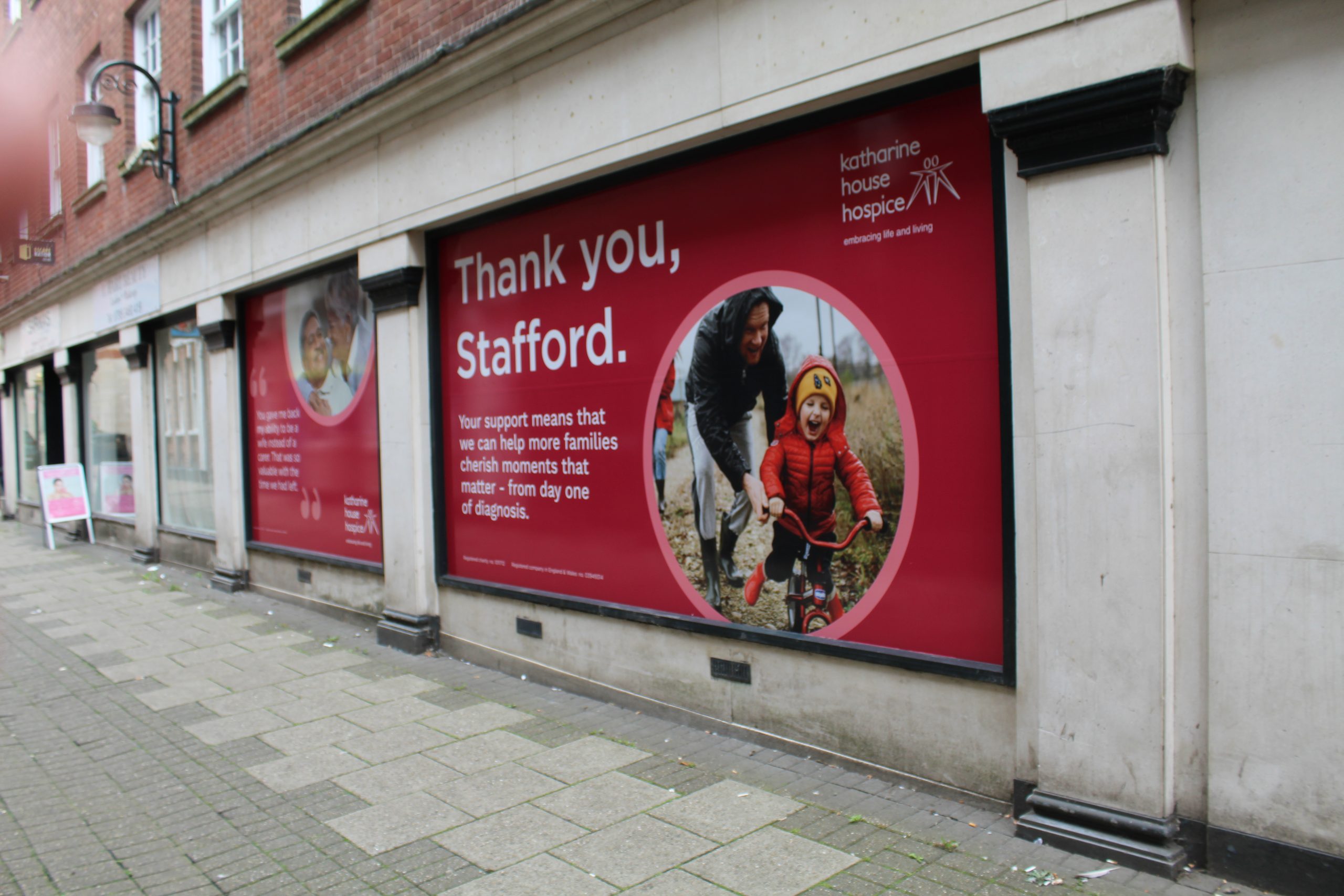 Shop window decals say 'Thank you, Stafford'.